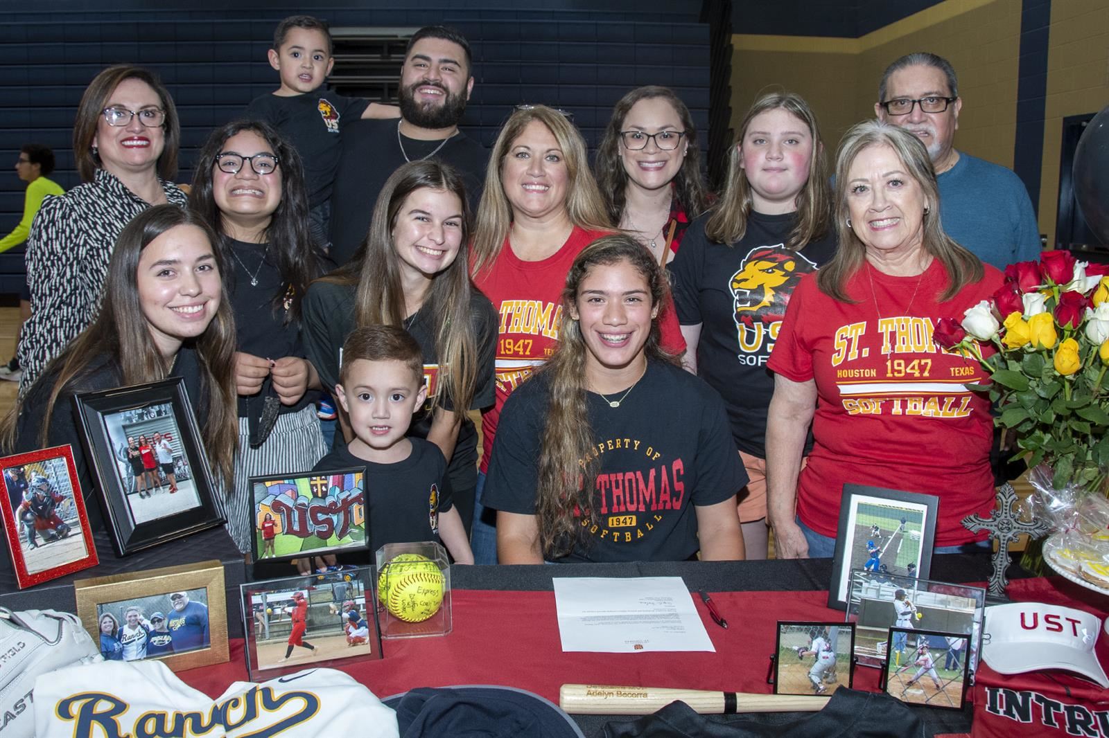 Cypress Ranch senior Adelyn Becerra, seated, signed her letter of intent to play softball at the University of St. Thomas.